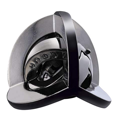 Silver metal puzzle with circular indentations and a sliding component.