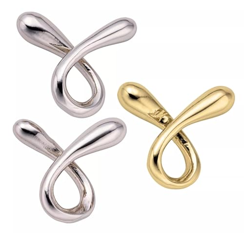 Silver and gold twisted puzzle with looping, flowing shapes.