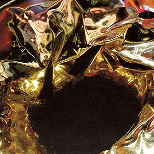 Shiny, abstract gold and black vinyl record cover detail.