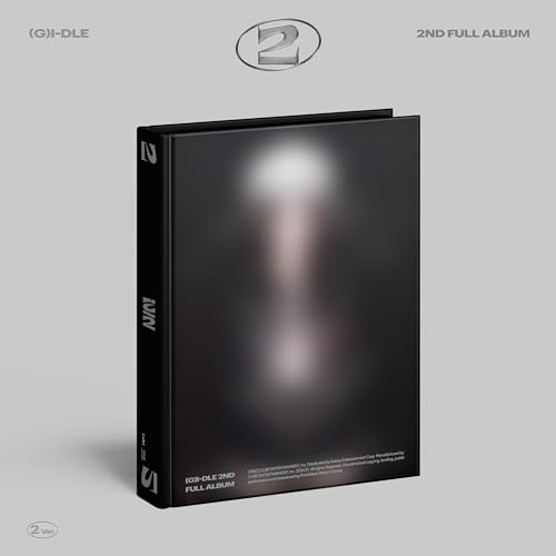 A black hardbound album case with a blurred central image against a grey background.