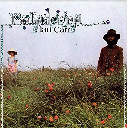 "Album cover with man and child standing in a field of tall grass and poppies."