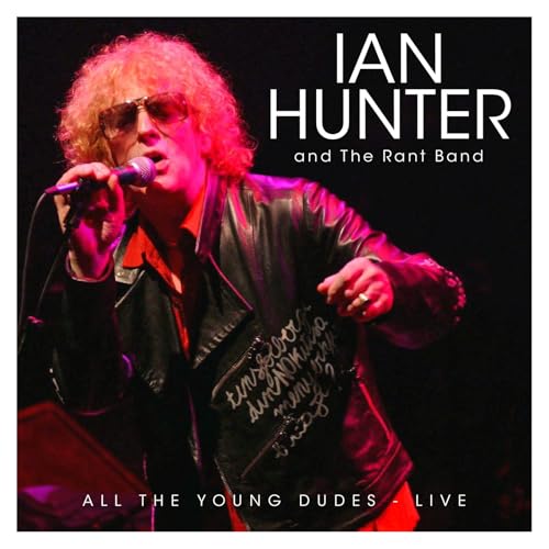 Ian Hunter performing live with a microphone, wearing sunglasses and a leather jacket.