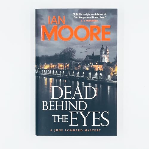 Book cover: “Dead Behind the Eyes” with a Loire Valley chateau image.