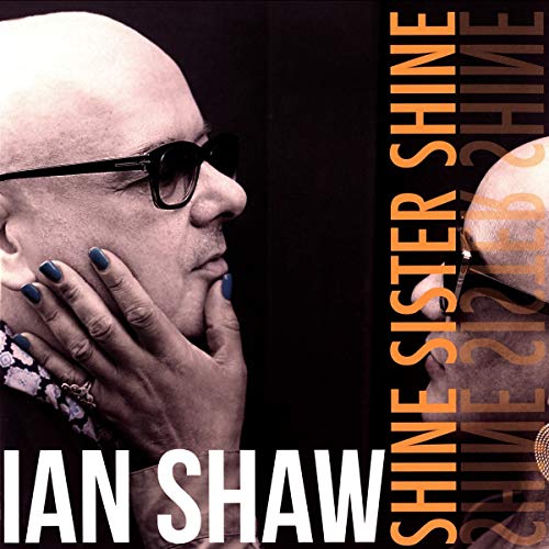 Vinyl album cover featuring a man with blue nail polish and sunglasses.