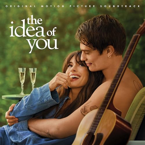 Couple embracing, with a guitar, for “The Idea Of You” soundtrack.