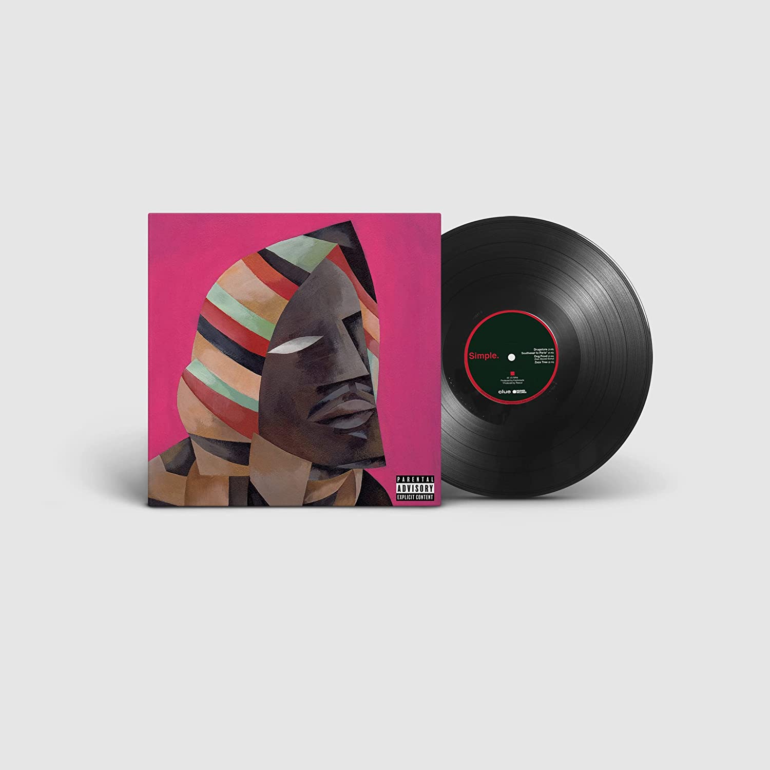 "Vinyl record and cover art featuring a cubist portrait of a person's face."