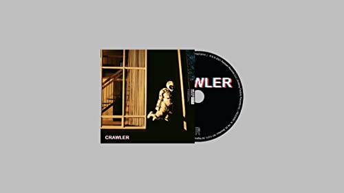 Idles’ “Crawler” CD cover: a person in a suit crawls through a doorway.