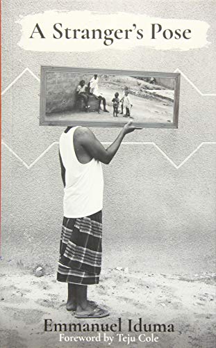 Book cover: man holding a framed photograph of people outdoors.