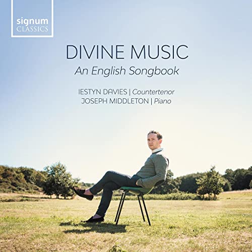 CD cover: Iestyn Davies, countertenor, seated in a grassy field.