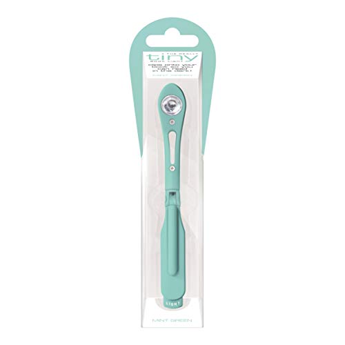 Small mint green book light with compact design and clip or stand attachment.
