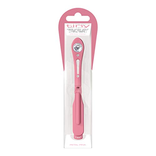 A petal pink clip-on book light inside its vertical retail packaging.