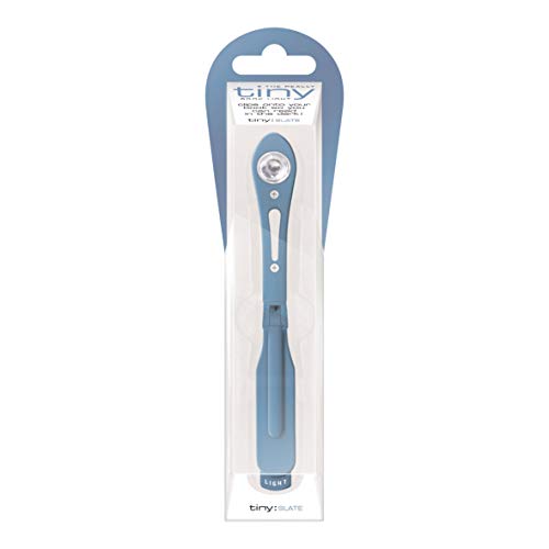 Slate blue clip-on book light in clear retail packaging against a white background.