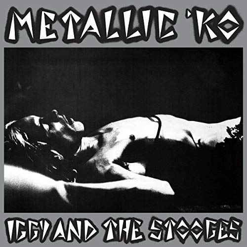 Black and white album cover featuring a reclining person and bold text.