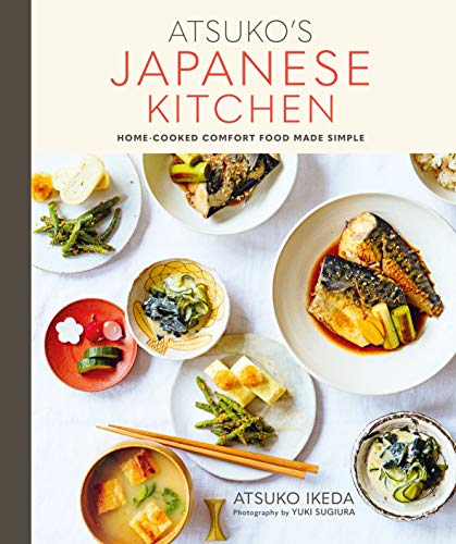 Cookbook cover with Japanese dishes arranged on a white linen surface.