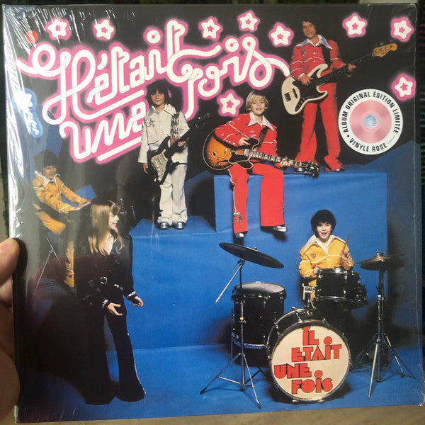 Vinyl cover featuring a band of children playing instruments against a blue background.