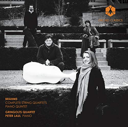 Black and white photo of four musicians with a double bass.