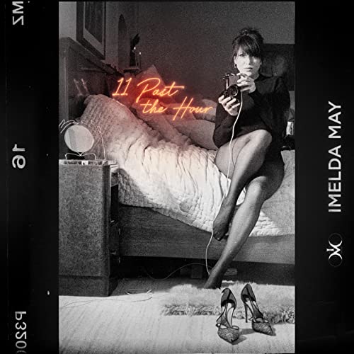 Imelda May album cover, black and white with red neon text and shoes.