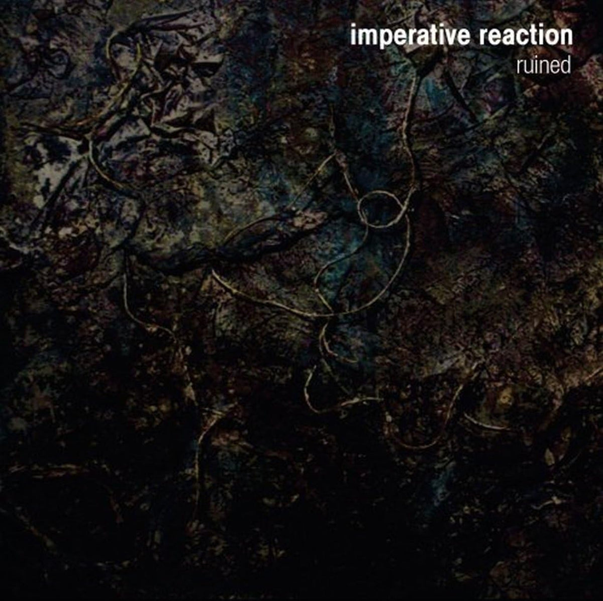 CD cover for "Imperative Reaction - Ruined" with abstract, dark imagery.