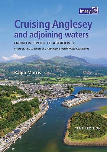 Book cover depicting a coastal town and mountains, titled "Cruising Anglesey".