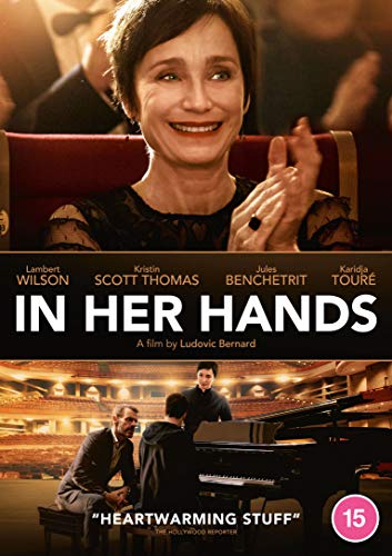DVD cover for "In Her Hands" featuring a woman clapping and a piano scene.