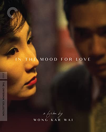 Close-up of a man and woman looking at each other on a movie cover.