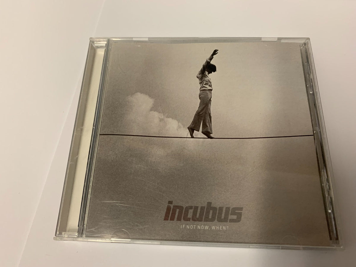 Incubus "If Not Now When" CD case with a man on a tightrope.