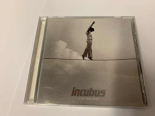 Incubus "If Not Now When" CD case with a man on a tightrope.