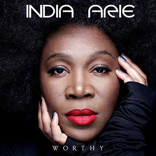 "Album cover featuring a woman with curly hair and red lips, titled 'Worthy' by India Arie."
