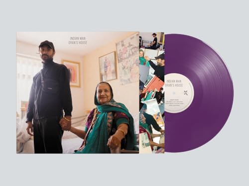 Vinyl record with album cover featuring a man and older woman indoors.