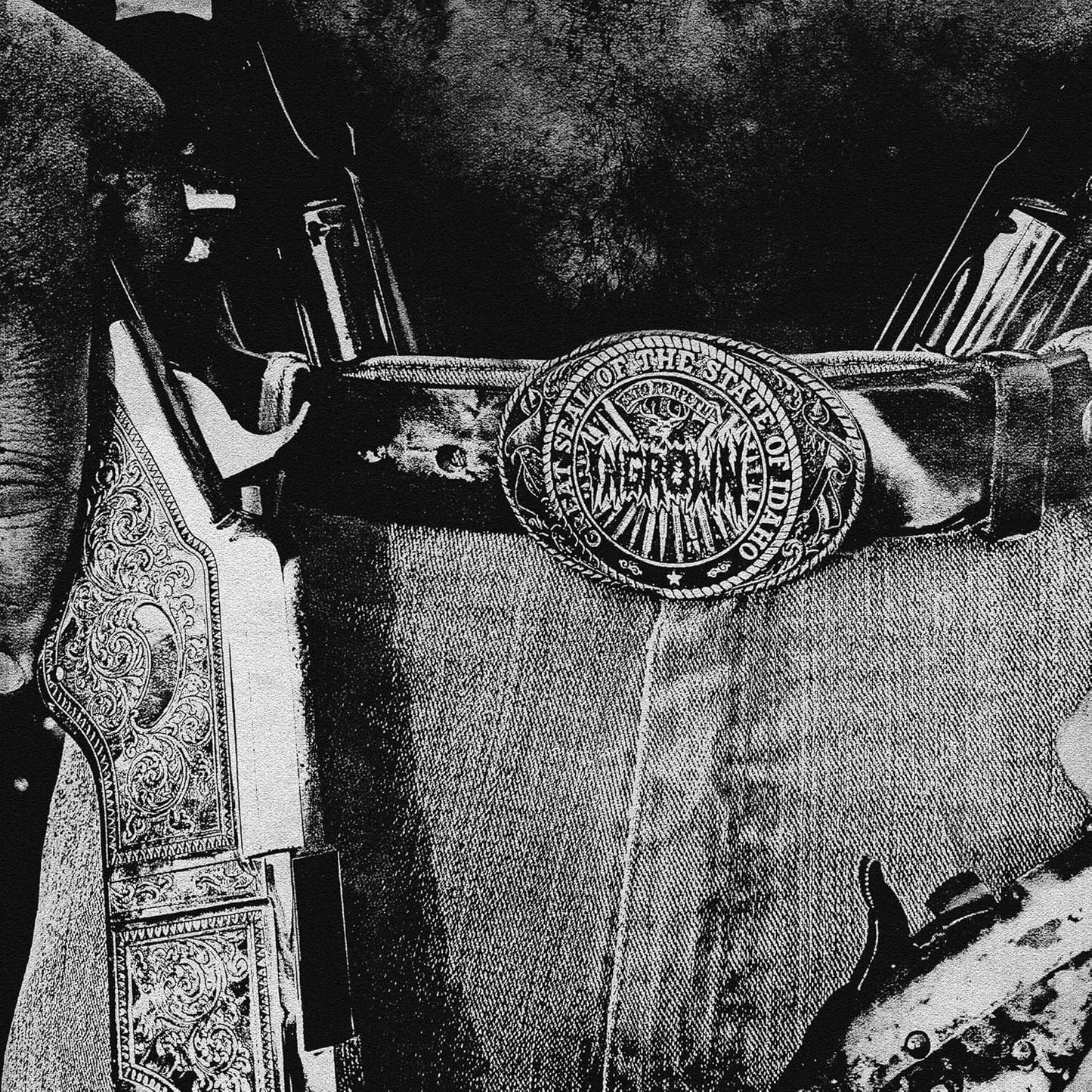 Black and white illustration of a saddle with Idaho state seal buckle.