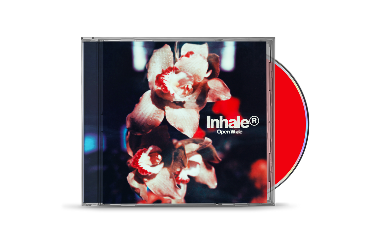 CD case with a blurry floral image and band name "Inhale".