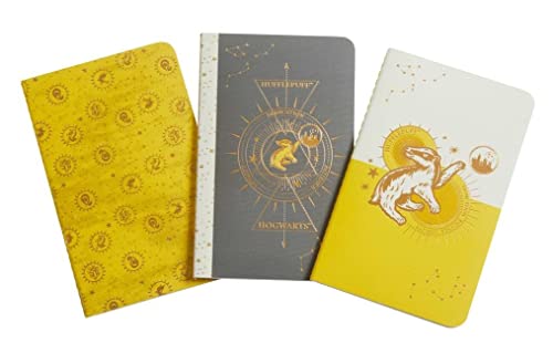 Three Hufflepuff-themed notebooks with badger and constellation designs.