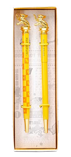 Yellow Hufflepuff pen and pencil set with badger toppers in box.
