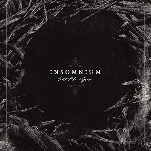CD cover for Insomnium’s “Heart Like A Grave” with dark, branch-like framing.