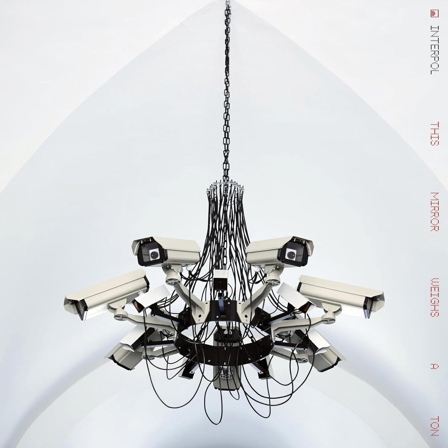 Interpol CD cover featuring a chandelier made of security cameras and a white disc.