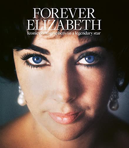 Close-up portrait of Elizabeth Taylor with striking blue eyes and pearl earrings.