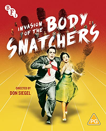Man and woman running from giant hand with people falling from fingers on movie poster.