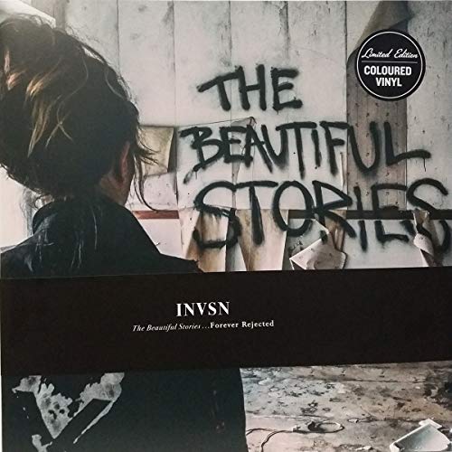 Vinyl album cover with graffiti-style text and a person’s back.