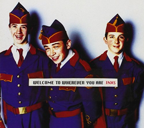 INXS album cover: three men in military-style hats and uniforms.