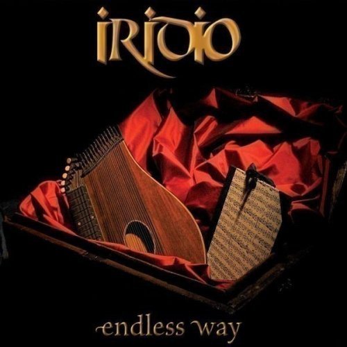 CD cover: a wooden harp-like instrument on red fabric.