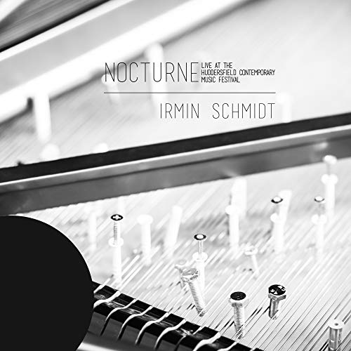 Black and white vinyl cover featuring a close-up of piano strings and hammers.