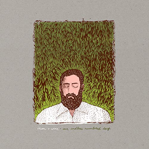 Album cover: bearded man in green foliage, “Iron & Wine” text below.