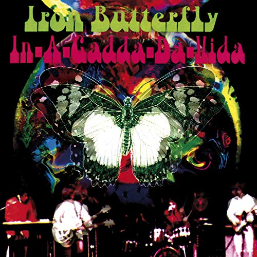 "Album cover featuring Iron Butterfly band performing, with a large butterfly graphic above."