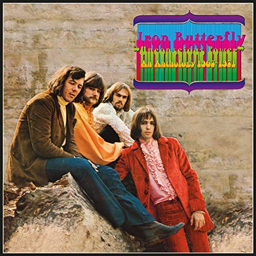 Iron Butterfly album cover featuring four band members in a landscape.