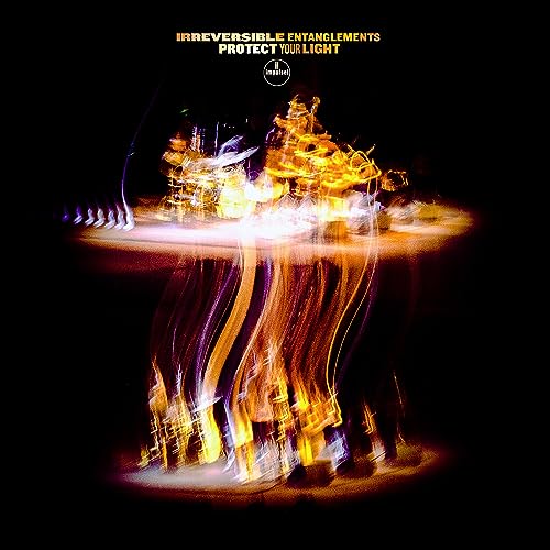 CD cover: abstract golden cityscape with light streaks on black background.