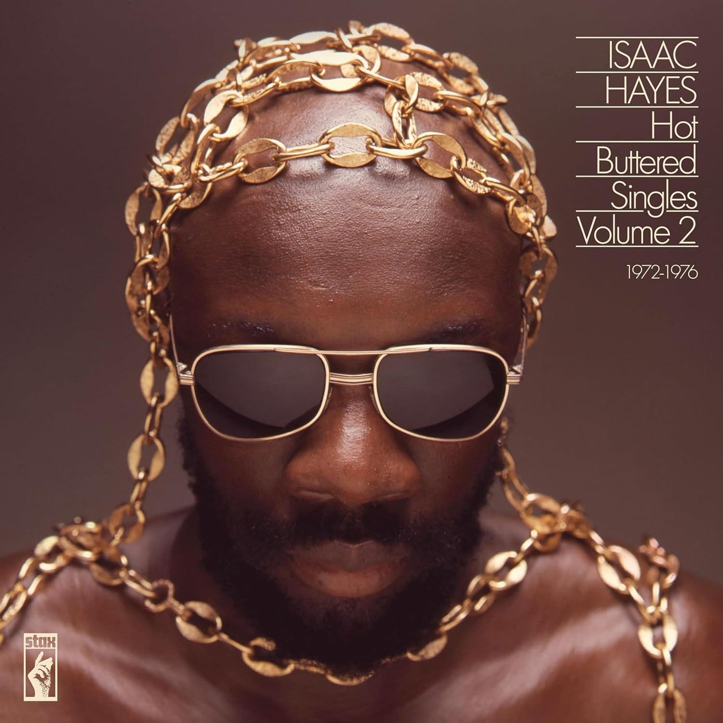 Isaac Hayes album cover: portrait of a man with gold chains and sunglasses.