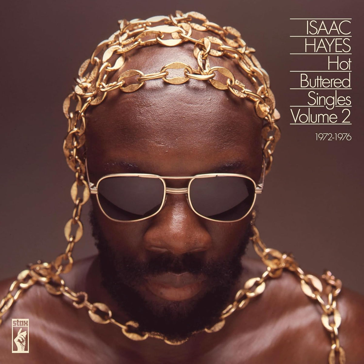 Isaac Hayes album cover: portrait of a man with gold chains and sunglasses.