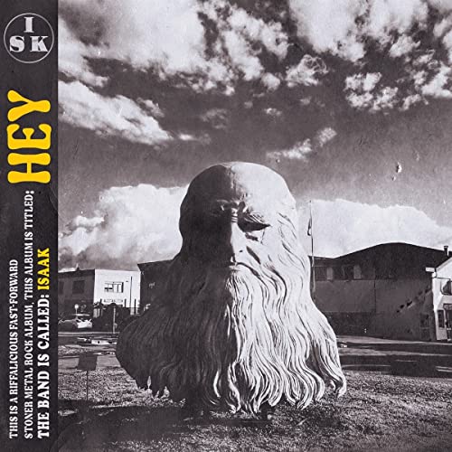 CD cover for Isaak’s “Hey” featuring a large stone face sculpture.