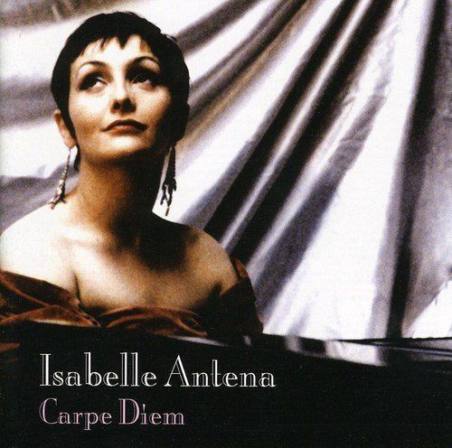 A CD cover featuring a woman in a red dress against a draped background.