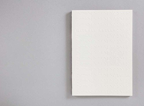 White book cover with embossed text and Braille, titled "Zebra.